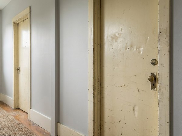 Hollow-core door hung crooked with uneven reveal before, service example