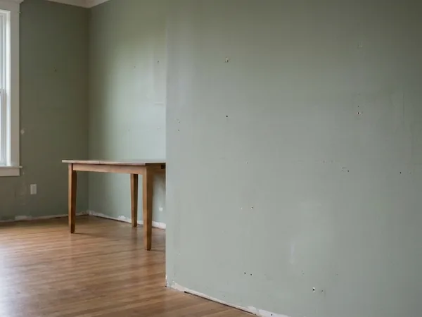 Plain drywall stairwell wall before, service example